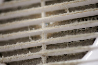 a closeup of a very dirty vent requiring air duct cleaning, air duct mold removal, and dryer vent cleaning in Hummelstown, PA